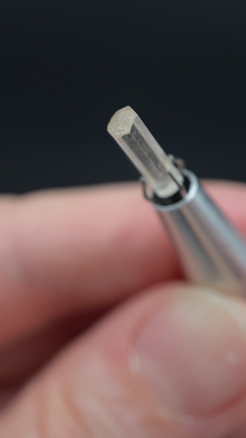 0.77 carat Burmese phenakite drill bit crystal for sale, glass clear, natural termination available at sanctuaryofstones.com video