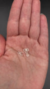 6-piece lot short Burmese phenakite crystals in hand to show size. available at sanctuaryofstones.com