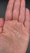 9-piece Burmese phenakite crystal lot in hand to show size. Available at sanctuaryofstones.com