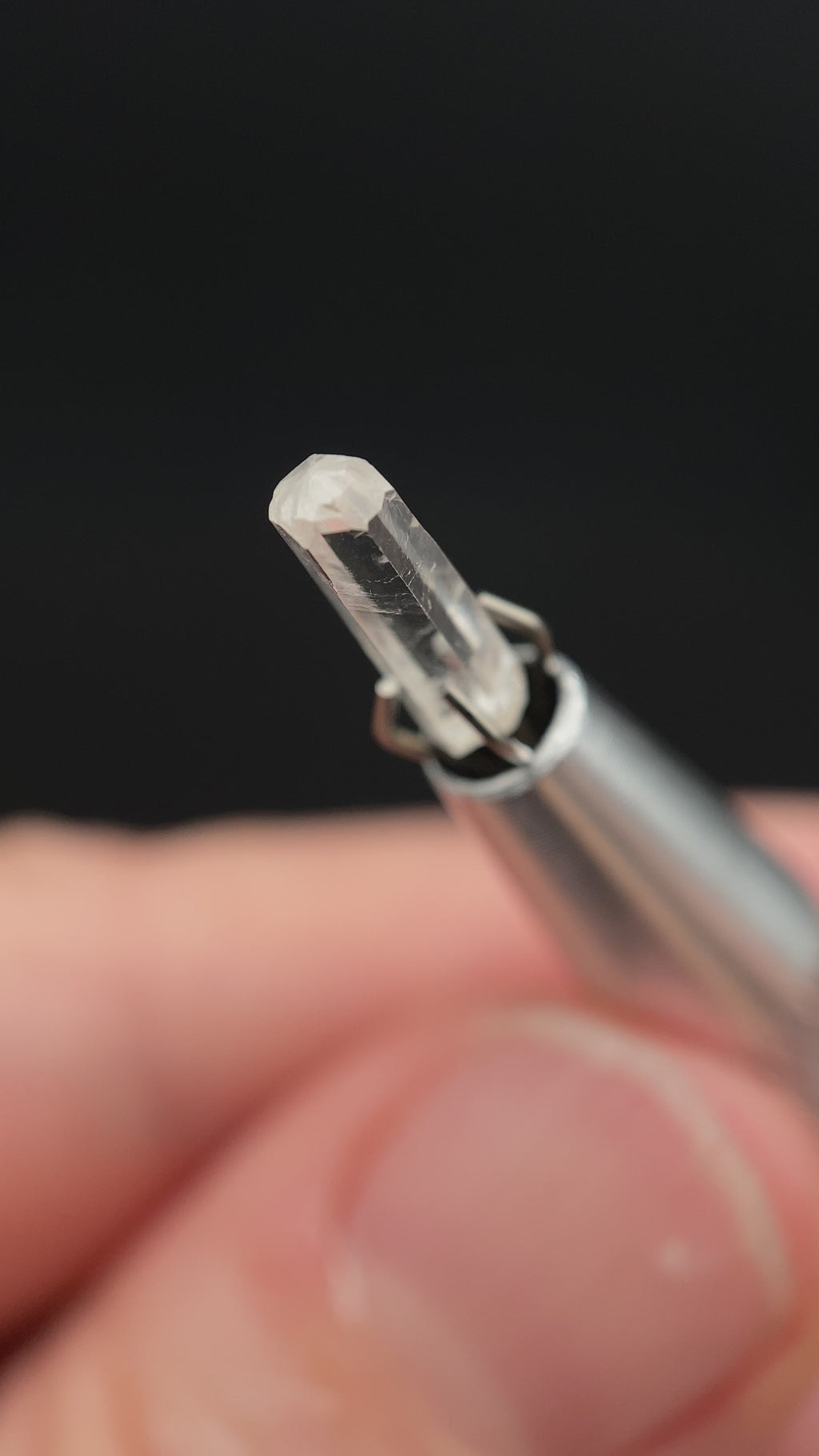 0.735 carat Burmese phenakite drill bit crystal for sale, glass clear, natural termination available at sanctuaryofstones.com video