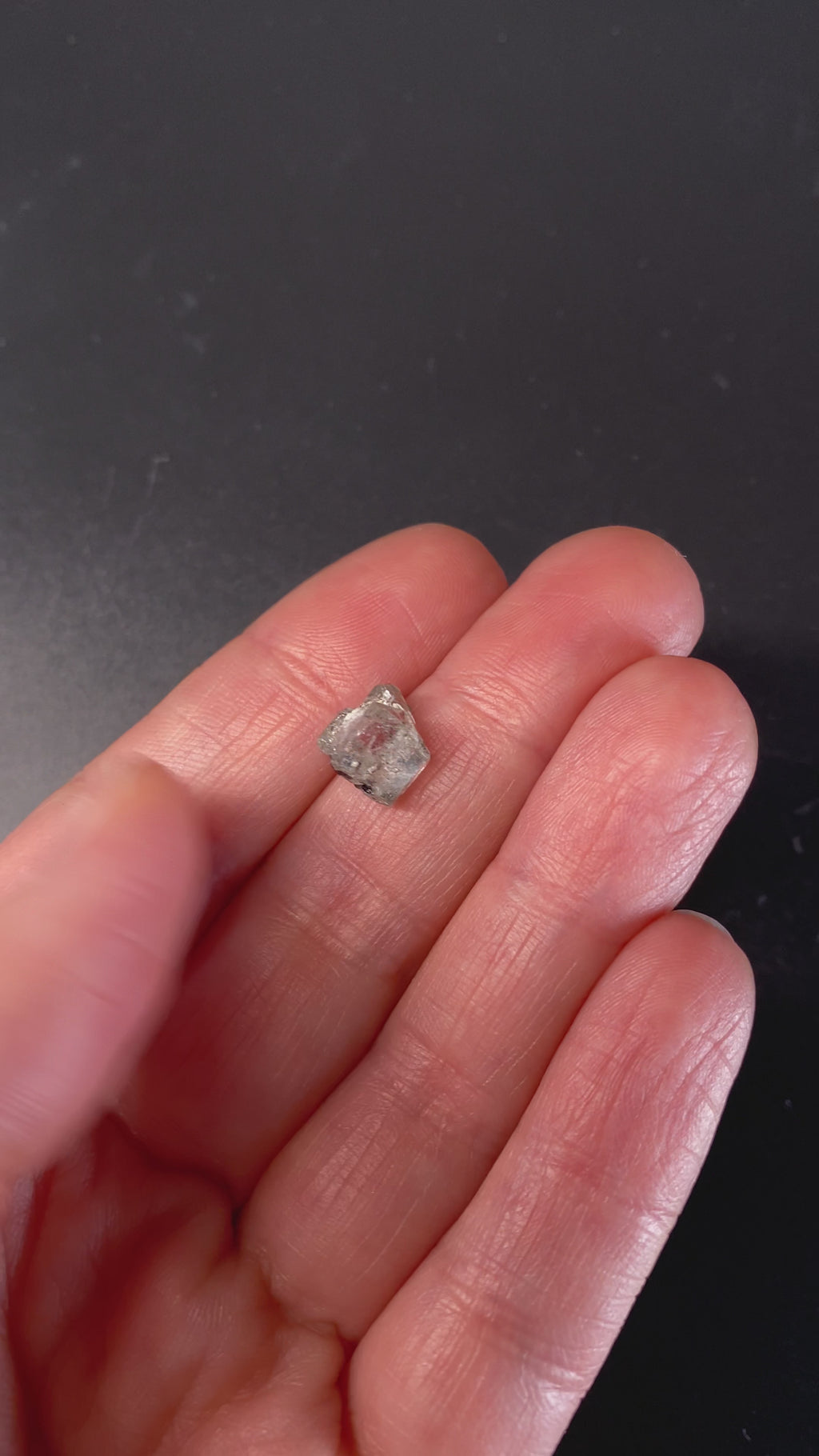 0.81 gram raw Madagascar phenakite crystal with tourmaline inclusions available at sanctuaryofstones.com