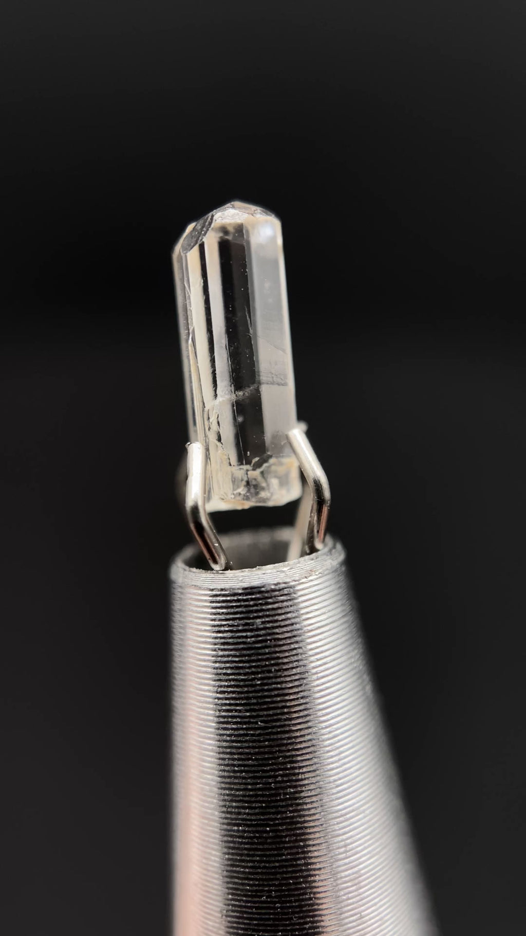 0.57 carat Burmese phenakite drill bit crystal for sale, glass clear, natural termination available at sanctuaryofstones.com video