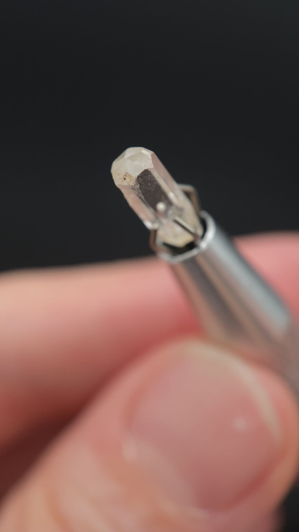 0.765 carat Burmese phenakite drill bit crystal for sale, glass clear, natural termination available at sanctuaryofstones.com video