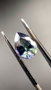 untreated peacock tanzanite pear cut gemstone, 1.88 carats, trichroic color phenomenon with blue, violet, fern-green colors, from sanctuary of stones dot com, video