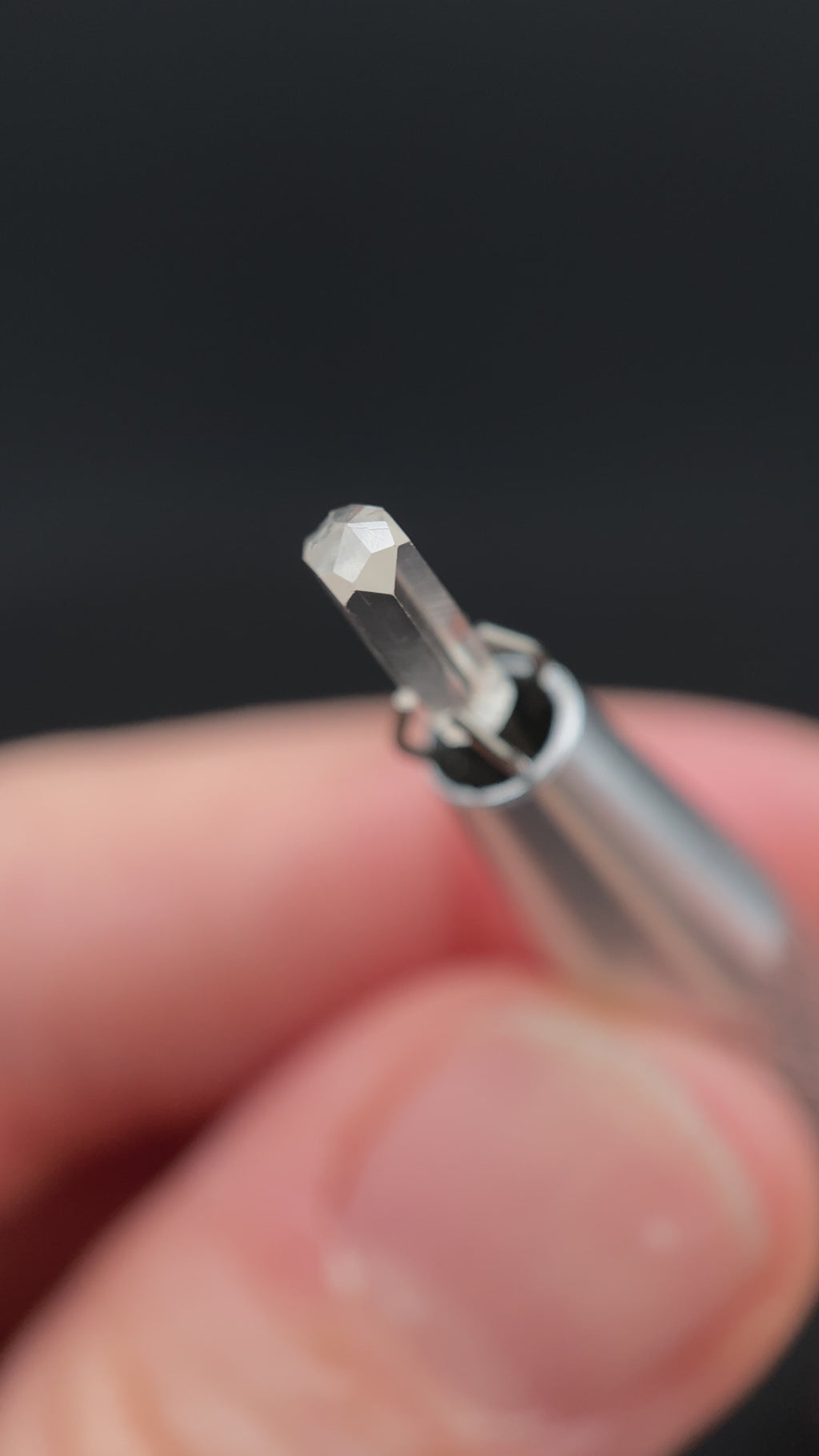 0.56 carat Burmese phenakite drill bit crystal for sale, glass clear, natural termination available at sanctuaryofstones.com video