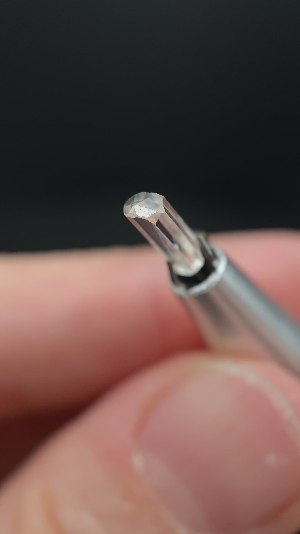 0.58 carat Burmese phenakite drill bit crystal for sale, glass clear, natural termination available at sanctuaryofstones.com video