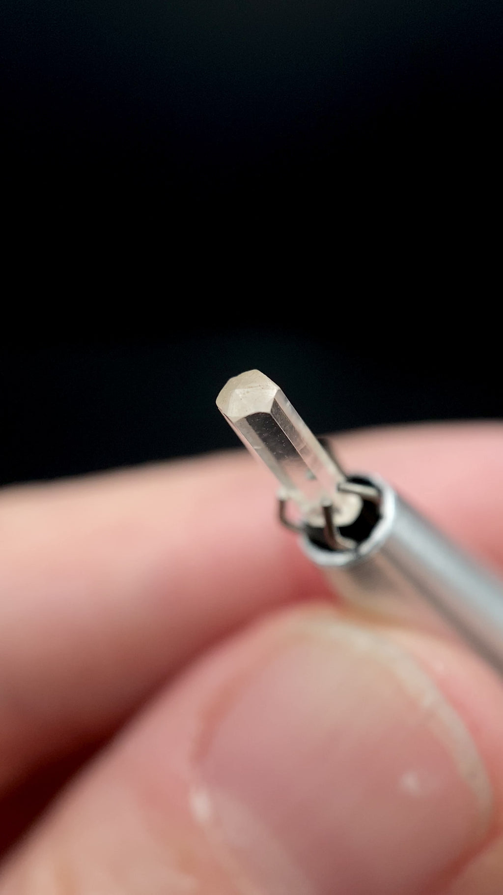 0.57 carat Burmese phenakite drill bit crystal for sale, glass clear, natural termination available at sanctuaryofstones.com video