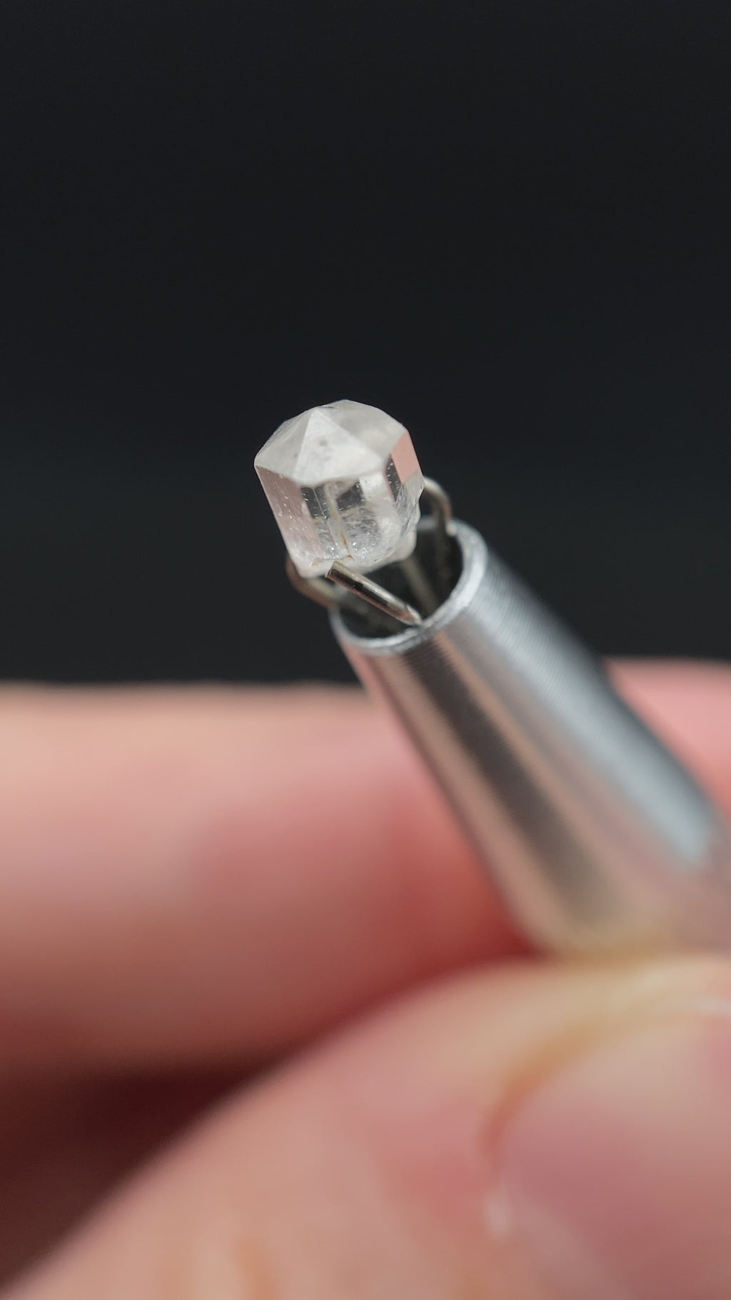 0.615 carat Burmese phenakite drill bit crystal for sale, glass clear, natural termination available at sanctuaryofstones.com video