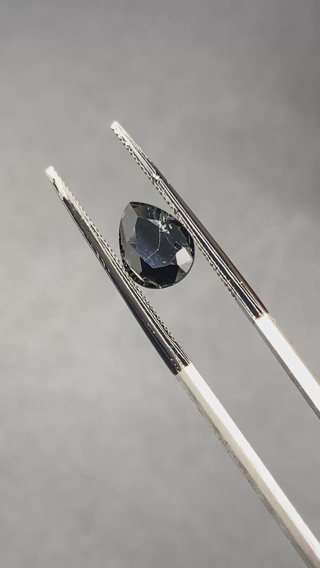 serendibite pear shaped 1.55 carat gemstone, opaque black-blue, very rare gemstone available on sanctuary of stones dot com, sanctuaryofstones.com video1