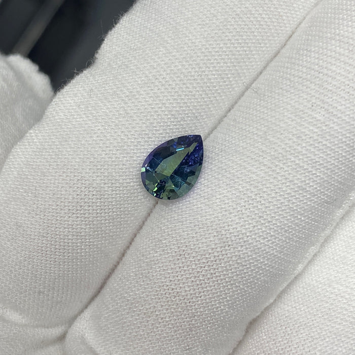 untreated tanzanite pear cut gemstone, 1.88 carats, trichroic color phenomenon with blue, violet, fern-green colors, from sanctuary of stones dot com, image 4