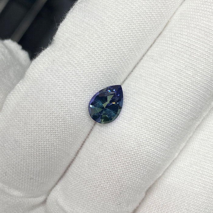 untreated tanzanite pear cut gemstone, 1.88 carats, trichroic color phenomenon with blue, violet, fern-green colors, from sanctuary of stones dot com, image 5