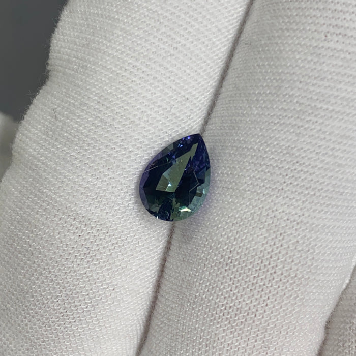 untreated tanzanite pear cut gemstone, 1.88 carats, trichroic color phenomenon with blue, violet, fern-green colors, from sanctuary of stones dot com, image 6