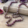 photo 1 of sanctuary vibrational jewelry's Calm Beyond the Veil hand-knotted beaded necklace with natural rutilated taupe moonstone and raspberry lepidolite with mica flecks