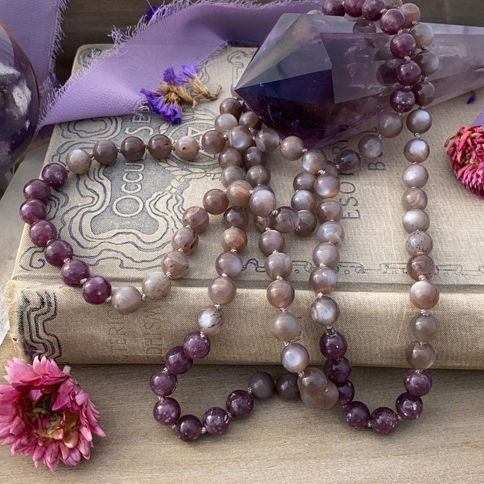 photo 4 of sanctuary vibrational jewelry's Calm Beyond the Veil hand-knotted beaded necklace with natural rutilated taupe moonstone and raspberry lepidolite with mica flecks